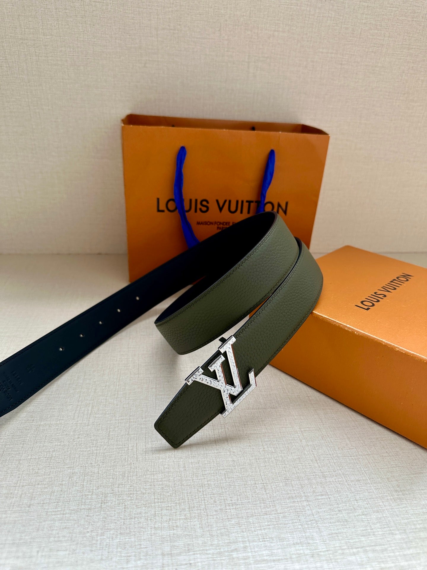 Dark green leather belt with silver LV buckle