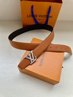Louis Vuitton belt, tan leather strap with silver LV buckle and pin holes