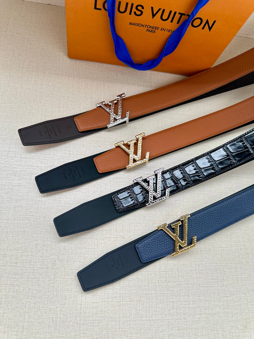 Louis Vuitton belt set, dark and blue straps with LV buckle accents