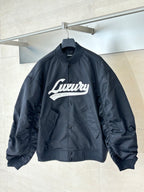 Dark navy bomber jacket with Luluvy graphic, snap front, stand collar, ribbed cuffs and hem
