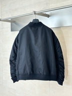 Navy bomber jacket back view with stand collar and elastic cuffs