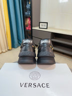 Versace platform sneakers back view, dark leather with gold baroque motifs