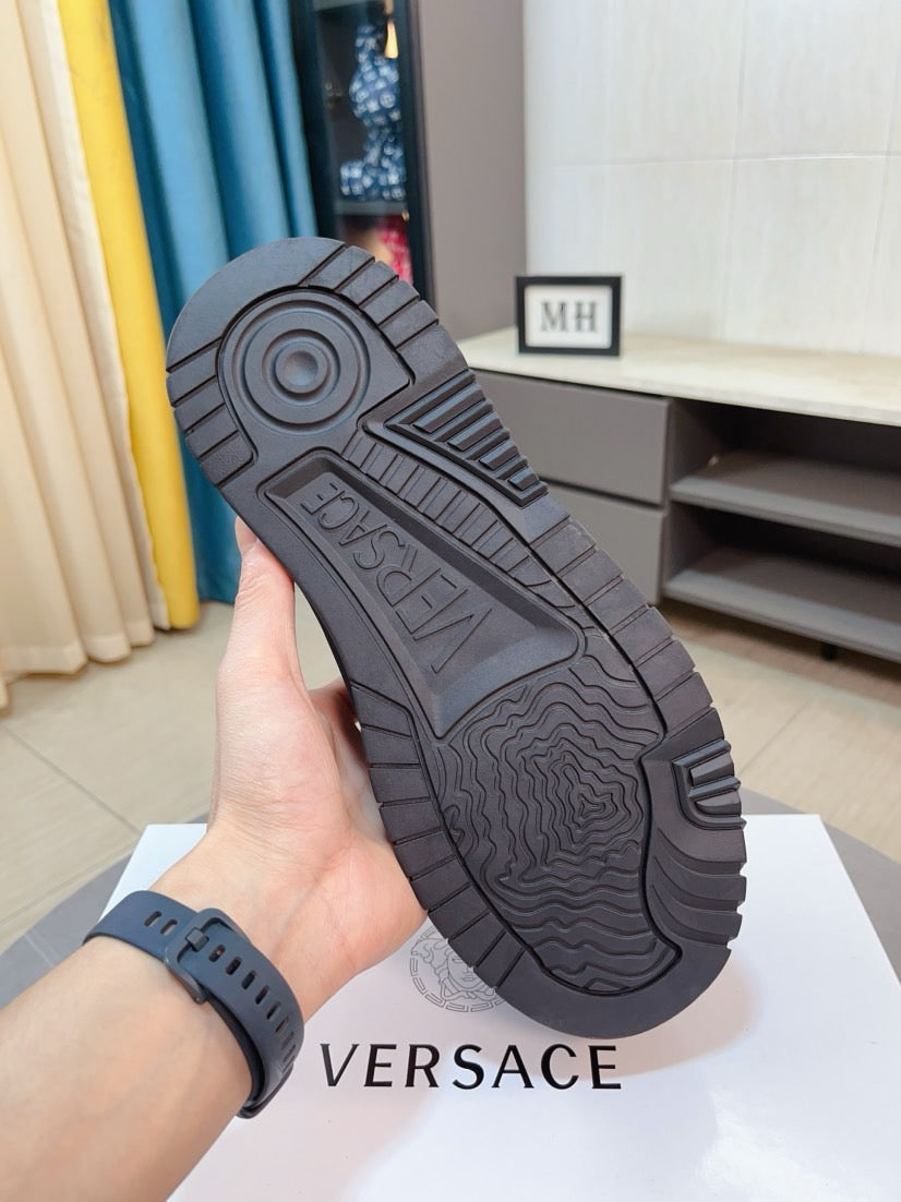 Versace platform sneaker outsole view, dark tread with circular logo detail