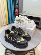 Versace platform sneakers set in white and dark, with gold baroque-style print