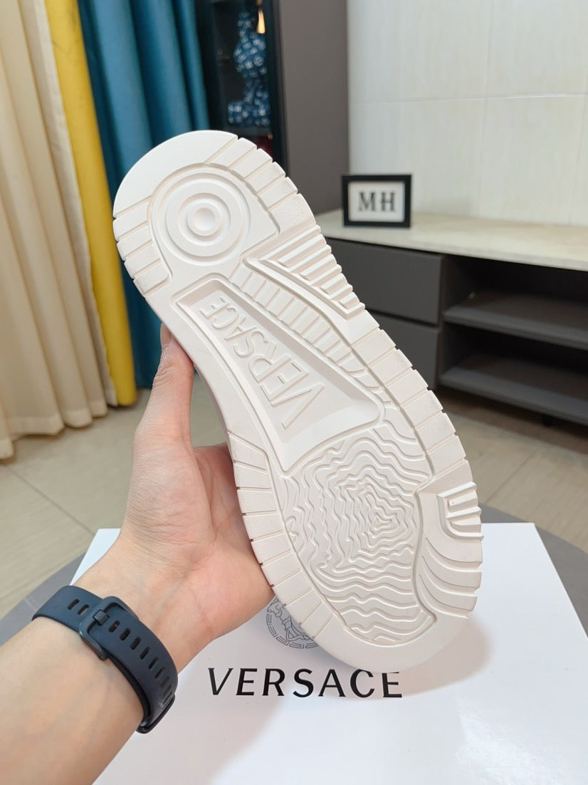 Versace white sneaker outsole view with tread pattern and embossed logo