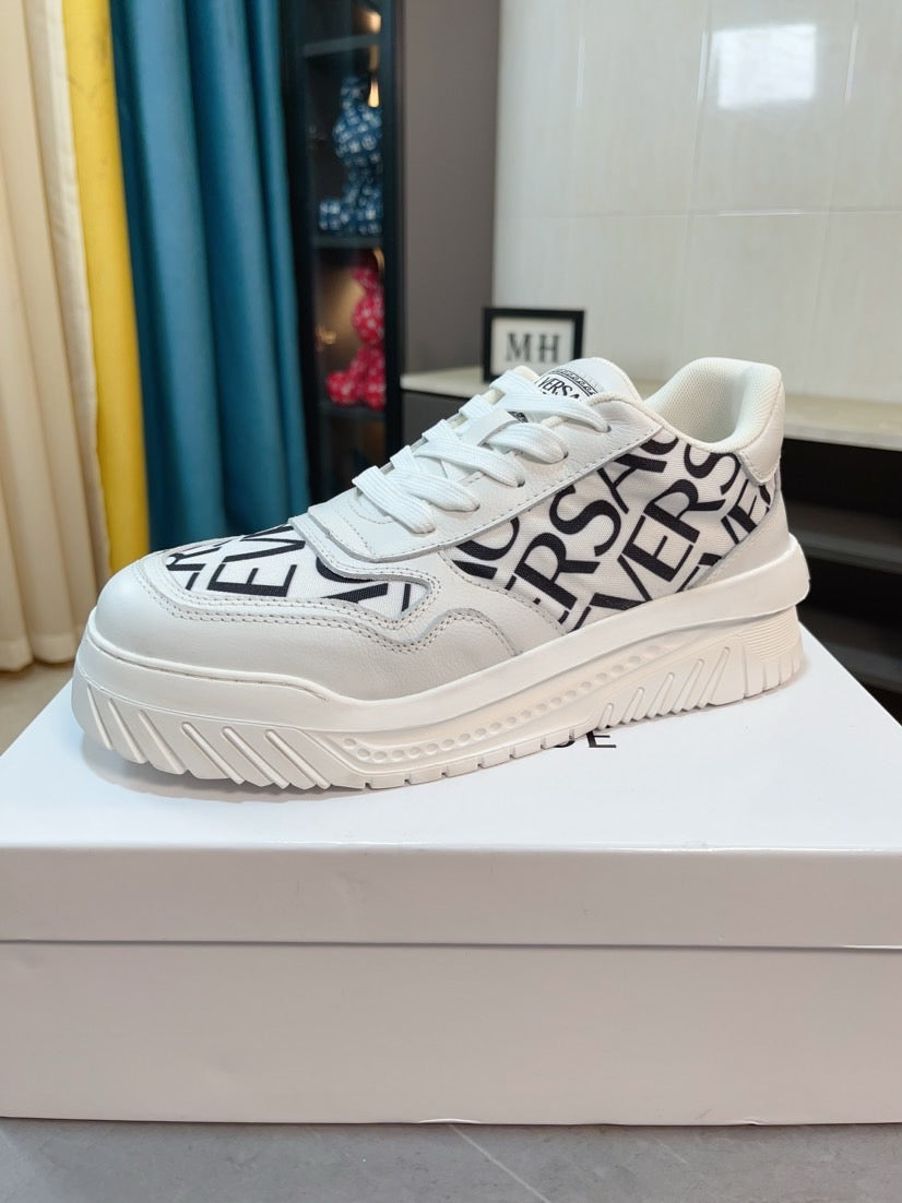 Versace white lace-up sneakers with large black logo lettering on the side