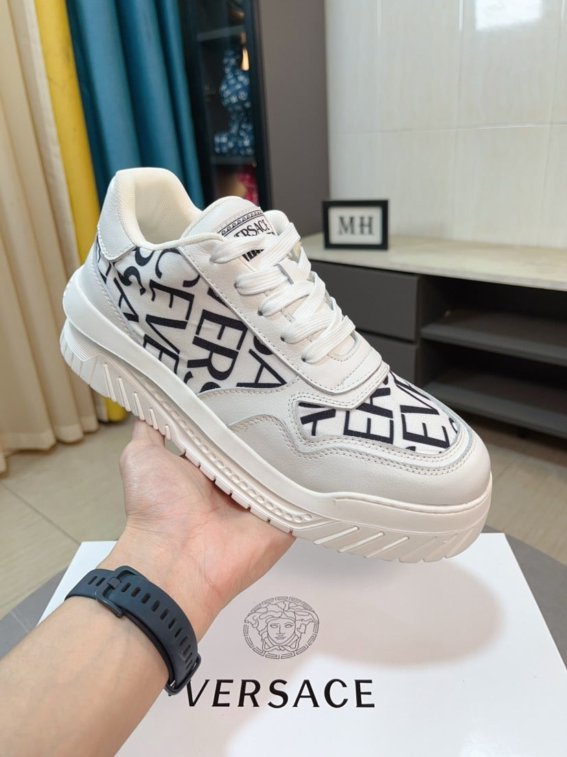 Versace white lace-up sneakers with black logo graphic and thick sole