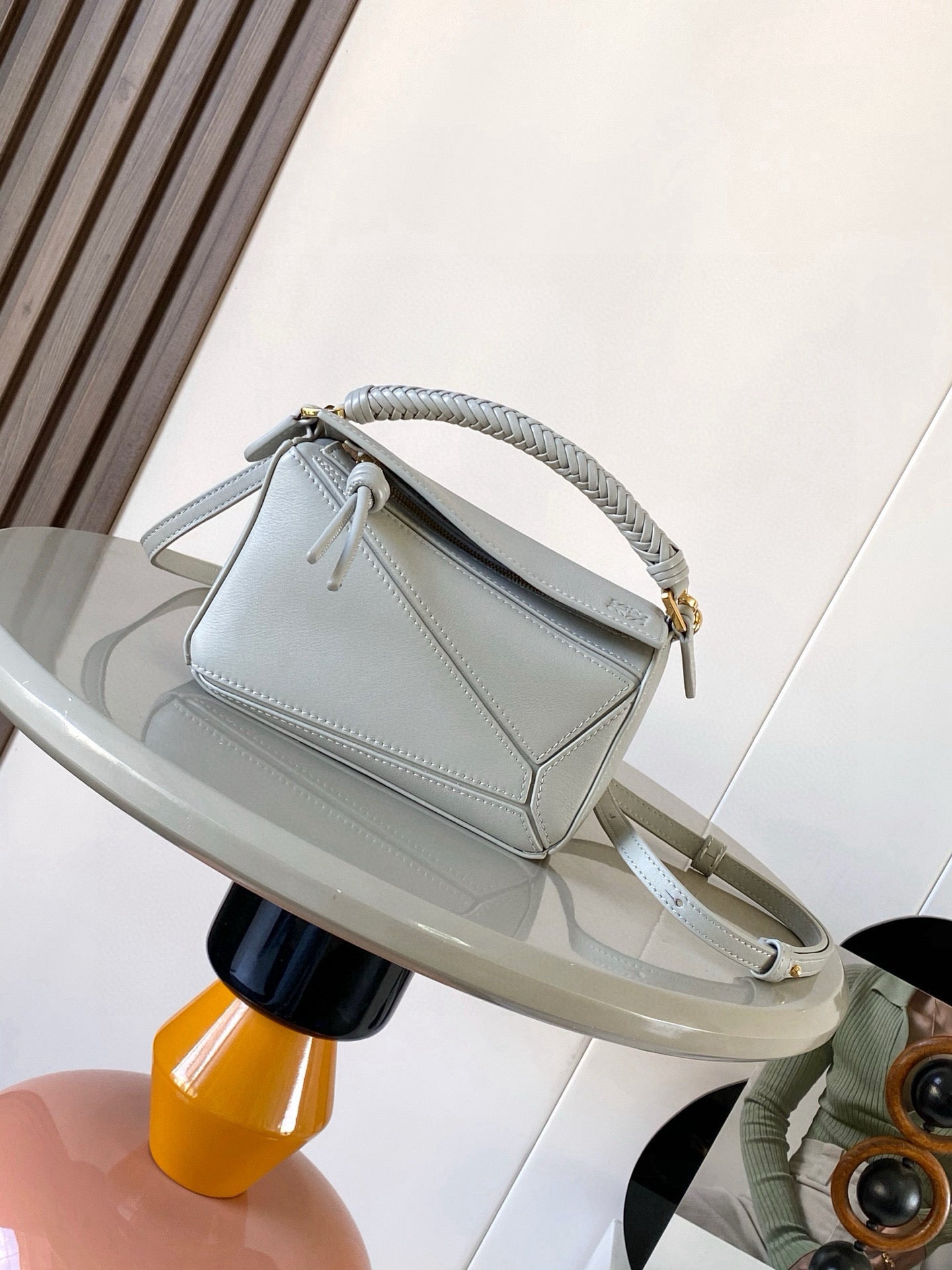 Light blue small crossbody bag with braided strap and gold clasp