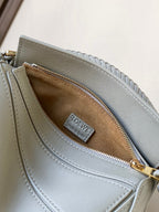 Light blue crossbody bag interior with brown lining and Loewe label