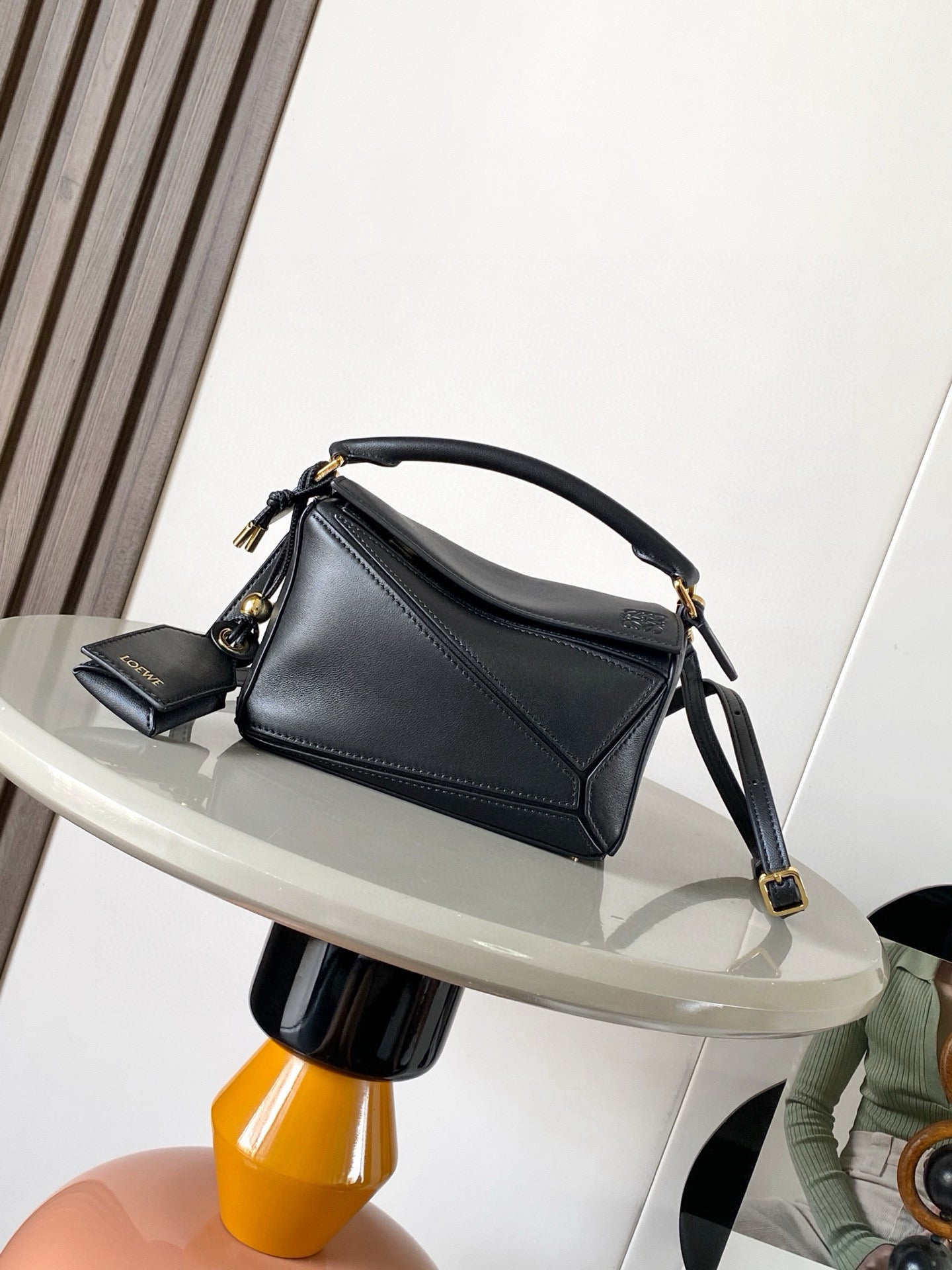 Loewe small leather shoulder bag, dark navy with gold hardware and crossbody strap