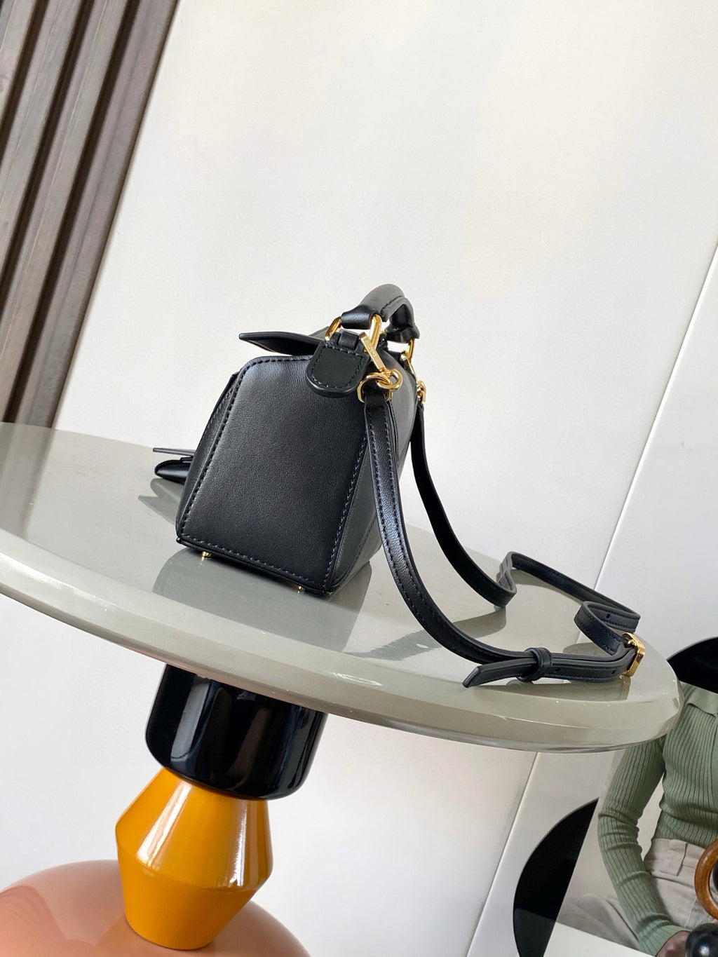 Loewe small leather crossbody bag, dark navy with curved handle and gold hardware