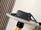 Loewe men’s black mini shoulder bag with crossbody strap and gold accent details.