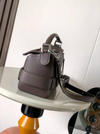 Leather top-handle bag with flap closure and detachable crossbody strap, taupe