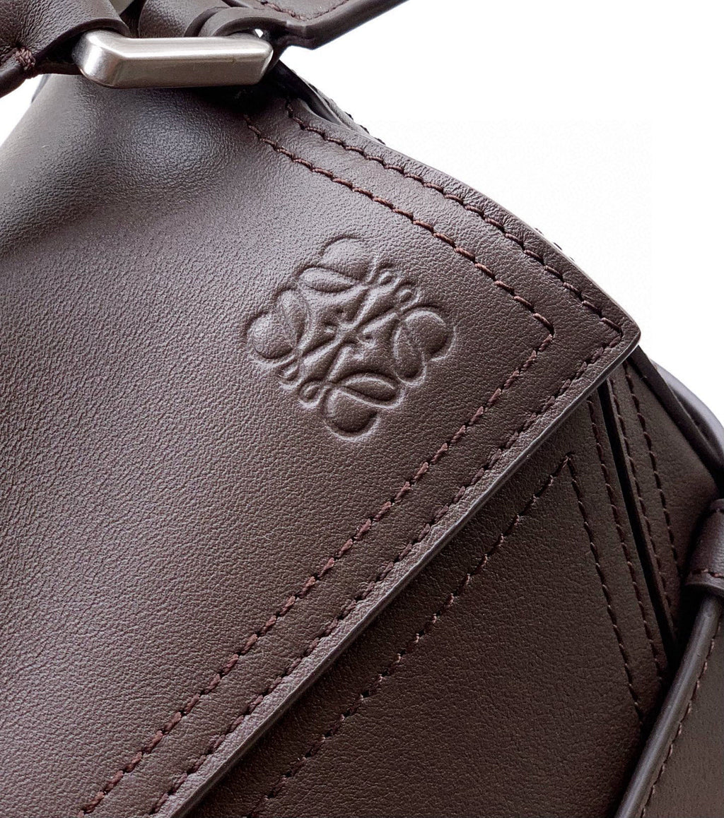 Leather bag panel with embroidered LOEWE logo and contrast stitching, dark taupe
