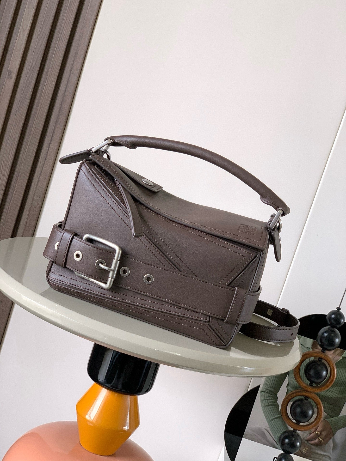 Loewe men’s leather shoulder bag in dark taupe, top handle and adjustable strap