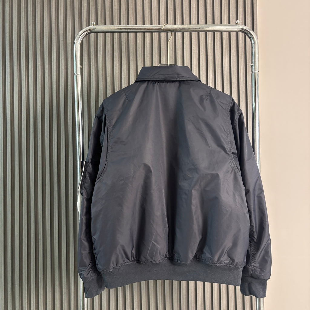Stone Island bomber jacket back view, dark navy with ribbed collar and cuffs