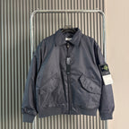 Stone Island zip-front bomber jacket, gray-blue with chest pockets and sleeve logo patch