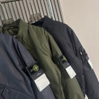 Stone Island zip-front bomber jackets, navy and olive green with chest logo patches