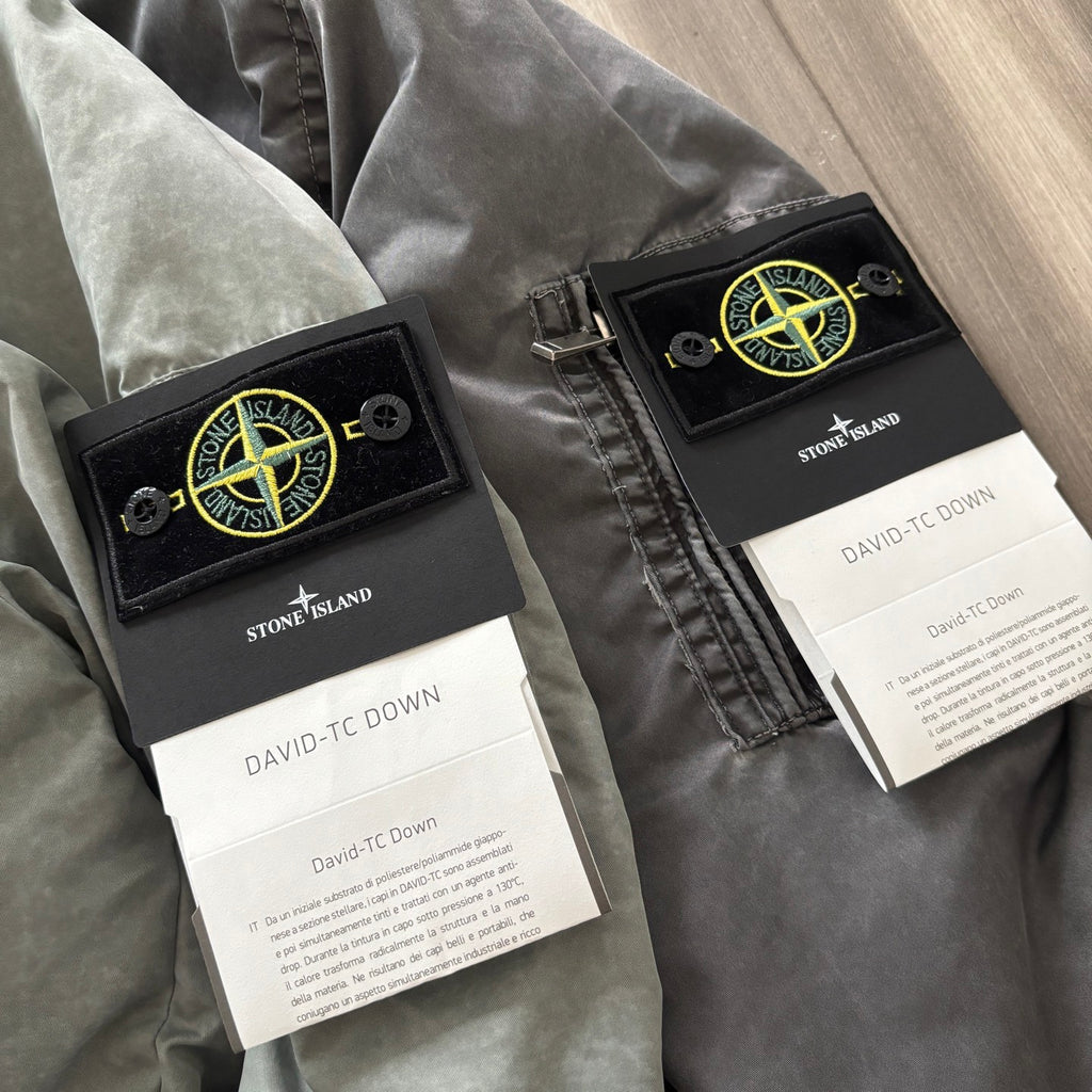 Stone Island jacket label set with DAVID-TC DOWN tags attached near zip