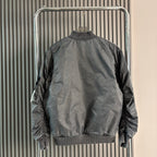 Stone Island bomber jacket back view in dark gray with ribbed collar, hem, and cuffs