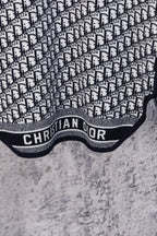 Dior hooded top featuring CHRISTIAN DIOR logo band and textured light fabric