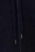 Navy zip-up hoodie front close-up, zipper track with metal pulls