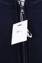 Navy hoodie close-up of front zipper and Dior hang tag