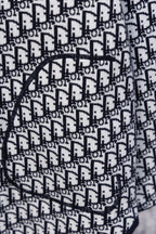 Dior hooded top chest detail with black drawstring and monogram pattern