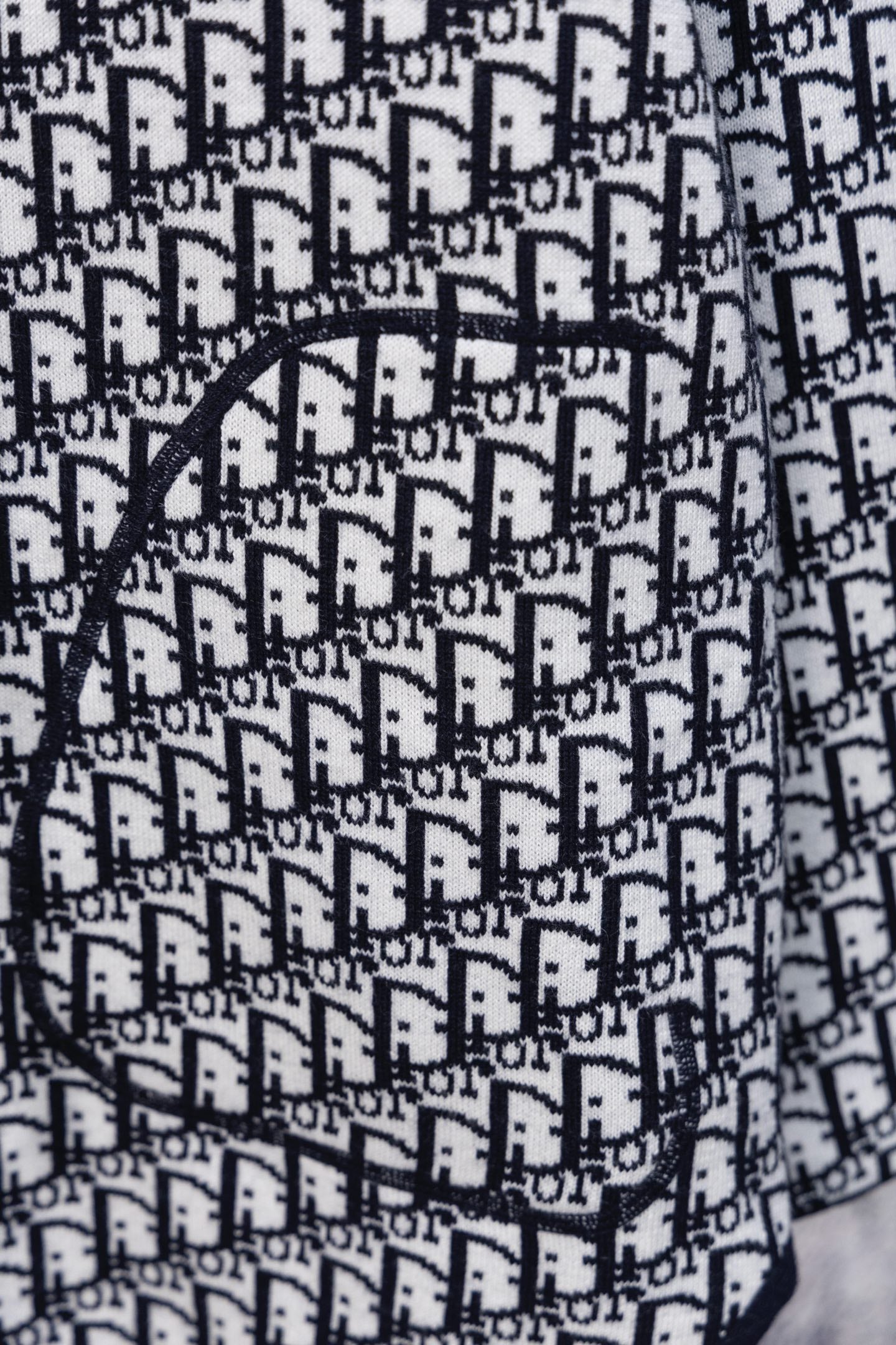 Dior hooded top chest detail with black drawstring and monogram pattern