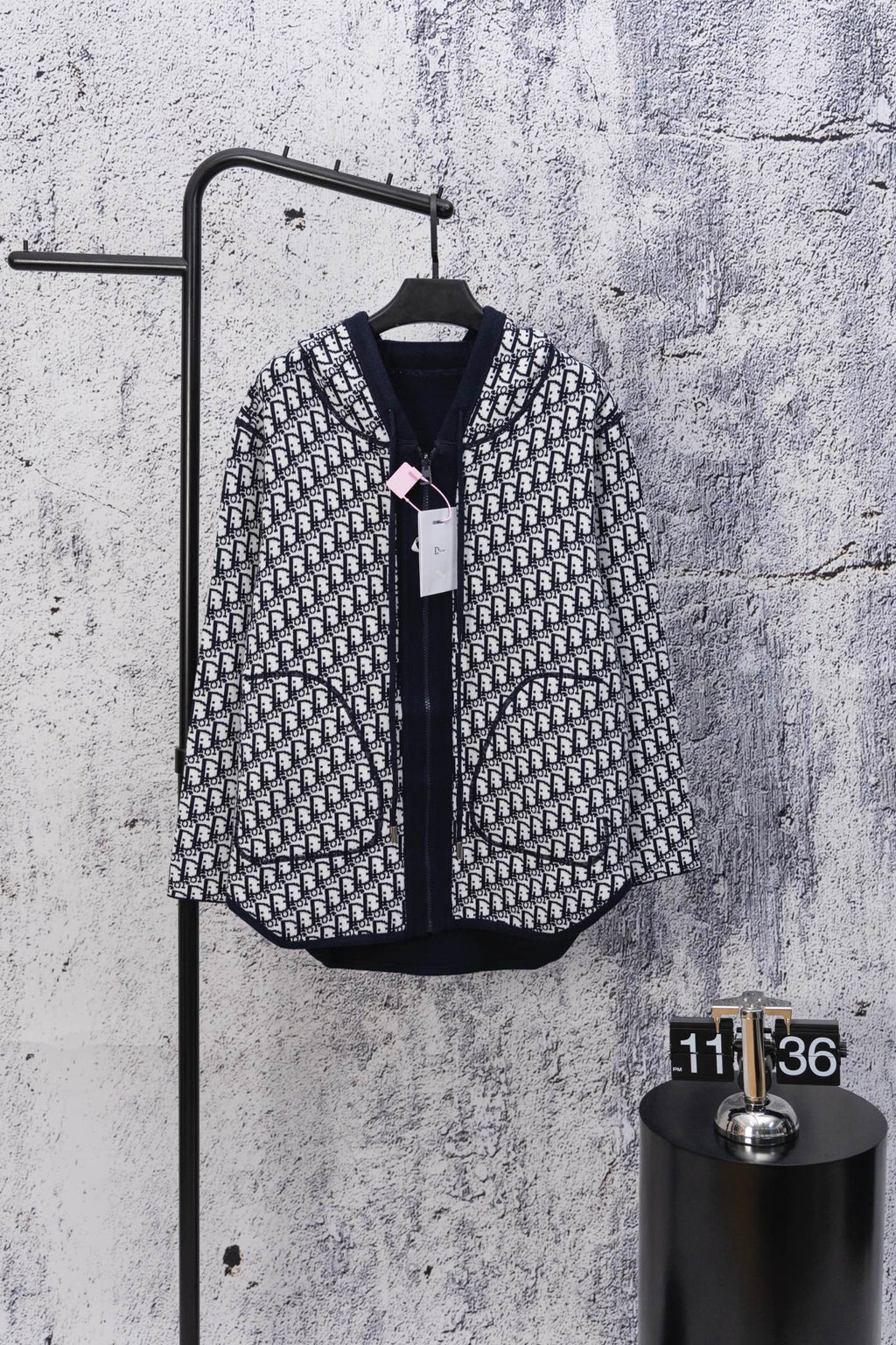 Zip-up hooded sweatshirt, black-and-white patterned knit, front zipper view