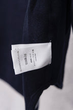Dior hooded top showing back care label tag on navy fabric