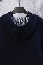 Dior navy hooded top on hanger with patterned inner collar lining