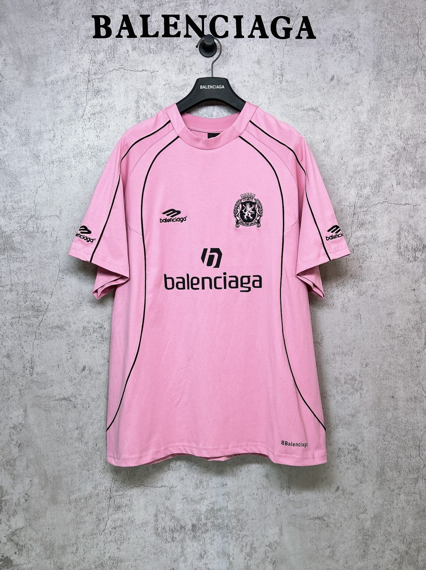 Balenciaga short-sleeve T-shirt, pink with black logo and crest on the front