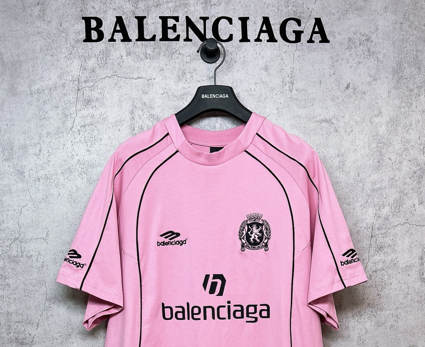 Balenciaga short-sleeve T-shirt, pink front with black crest and logo text