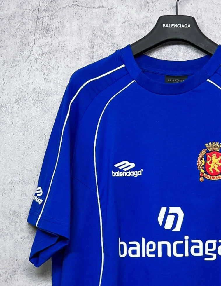Blue short-sleeve jersey with white piping and partial front logo print