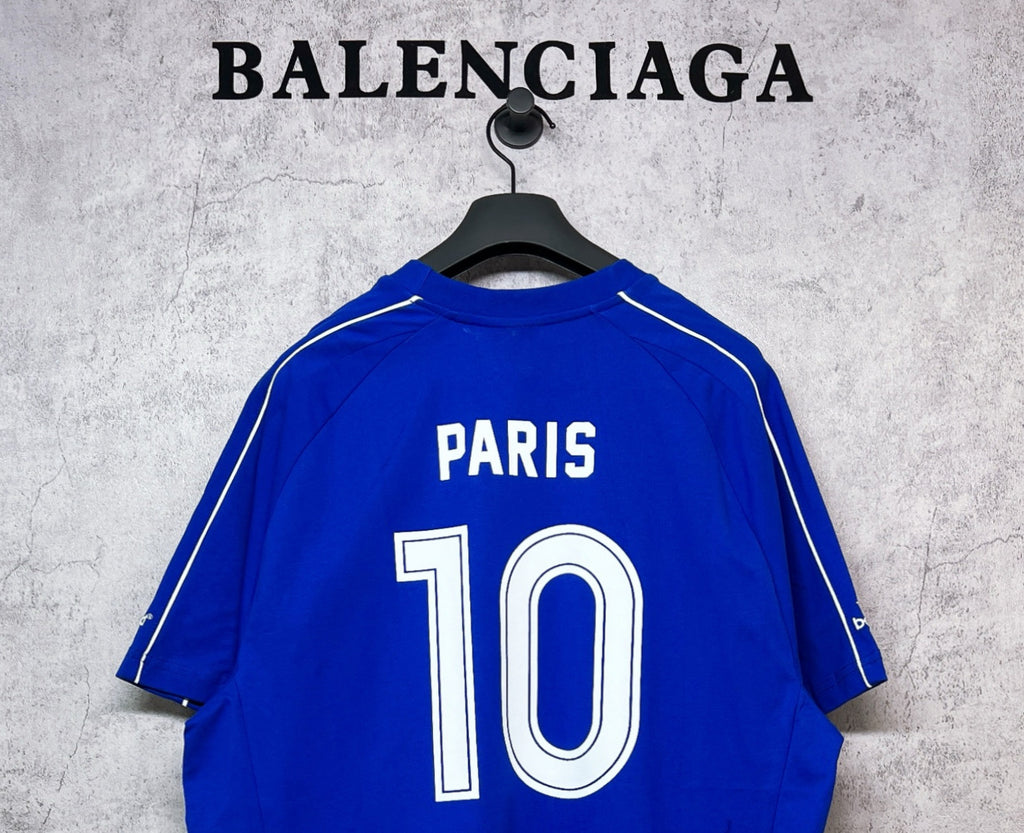 Blue short-sleeve jersey back with 'PARIS' text near neckline