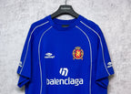 Blue short-sleeve jersey with crest emblem and balenciaga logo at center