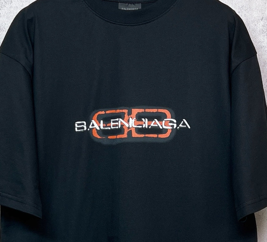 Balenciaga black short-sleeve T-shirt with orange and white logo graphic centered