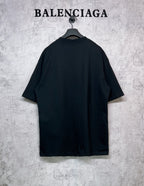Balenciaga black short-sleeve T-shirt, back view, hanging on a hanger