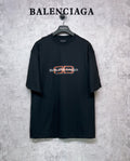 Balenciaga black short-sleeve T-shirt with orange and white logo graphic on chest