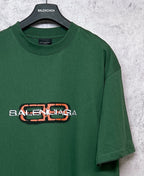Green T-shirt with Balenciaga logo print, angled side view