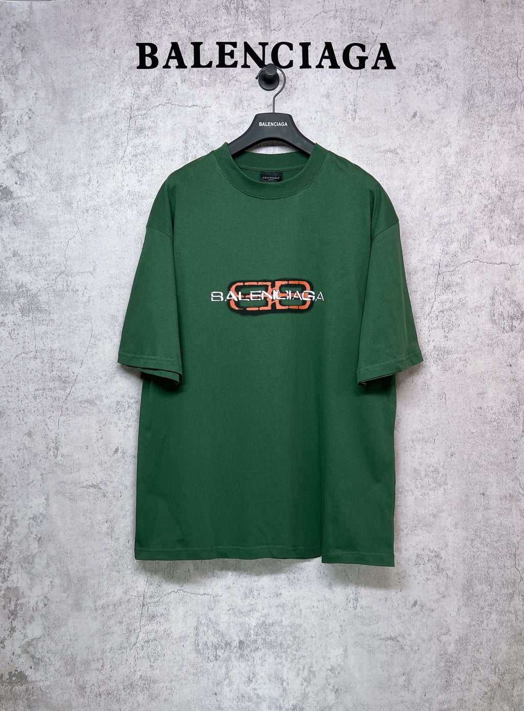 Green T-shirt with Balenciaga logo print on chest, short sleeves