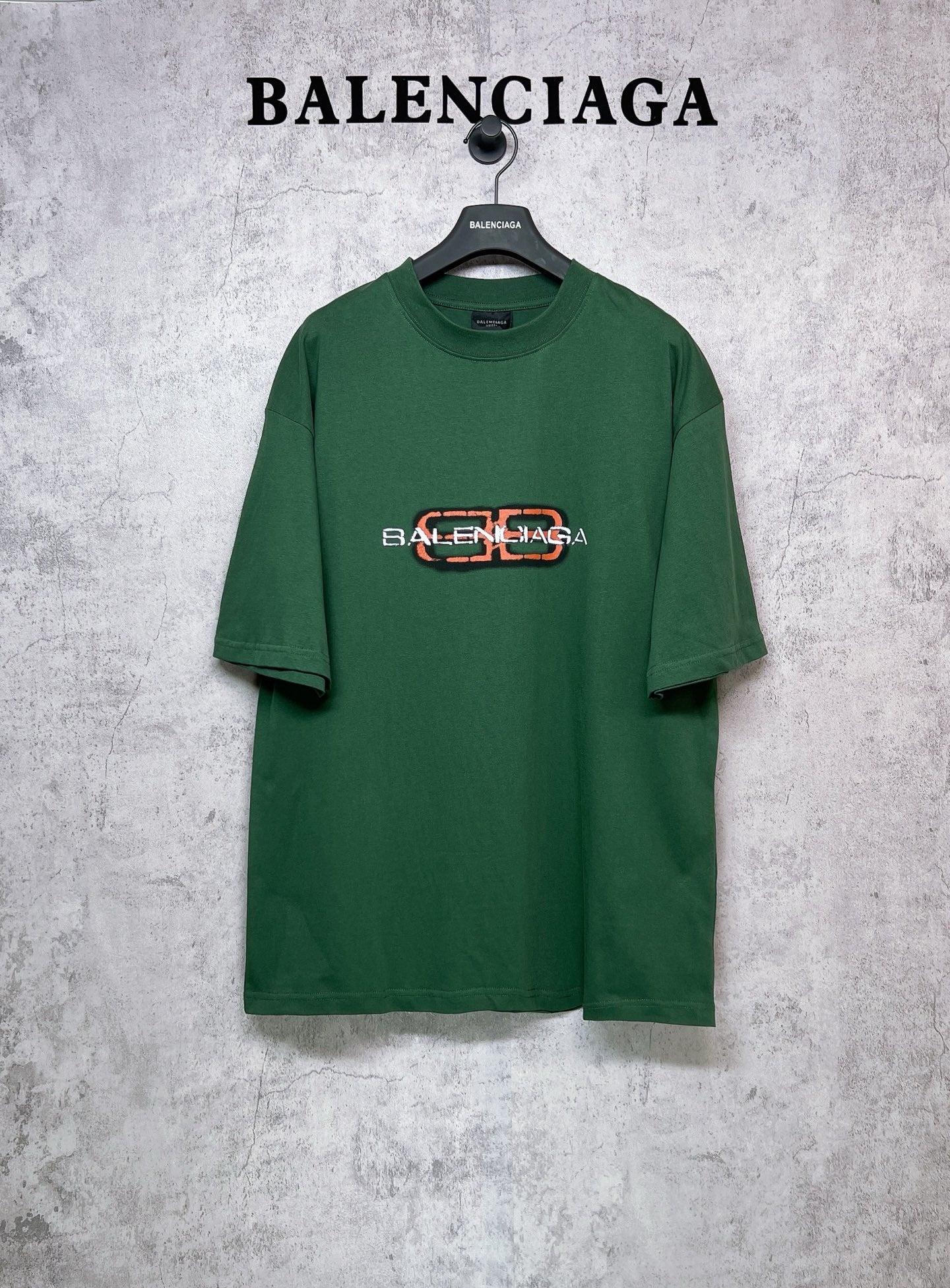 Green T-shirt with Balenciaga logo print on chest, short sleeves