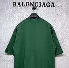 Green T-shirt back view on hanger, short sleeves