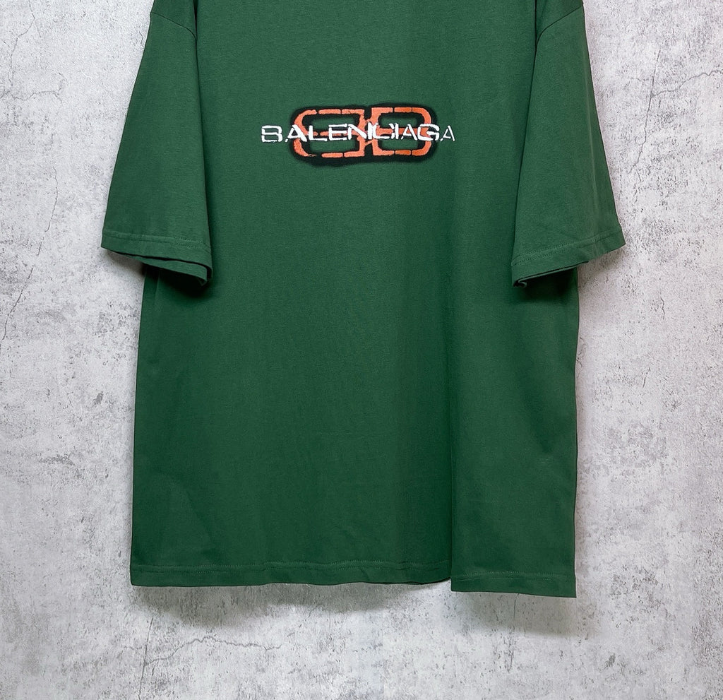 Green T-shirt lower front view with Balenciaga logo print on chest