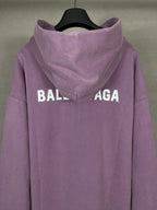 Purple long hoodie with adjustable hood and large back BALENCIAGA logo text.