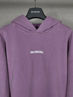 Purple long hoodie with draped cowl hood and small chest BALENCIAGA logo.