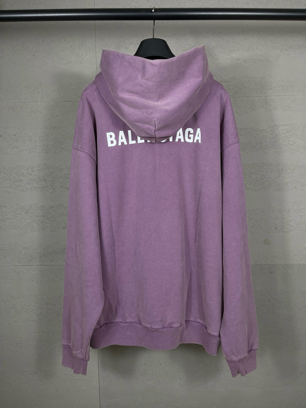 Purple long hoodie with adjustable hood and large back BALENCIAGA logo text.