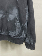 Balenciaga hoodie hem and kangaroo pocket detail with distressed print on dark fabric