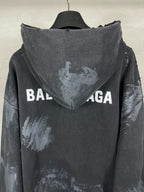 Balenciaga pullover hoodie back view with hood, distressed print and large logo text